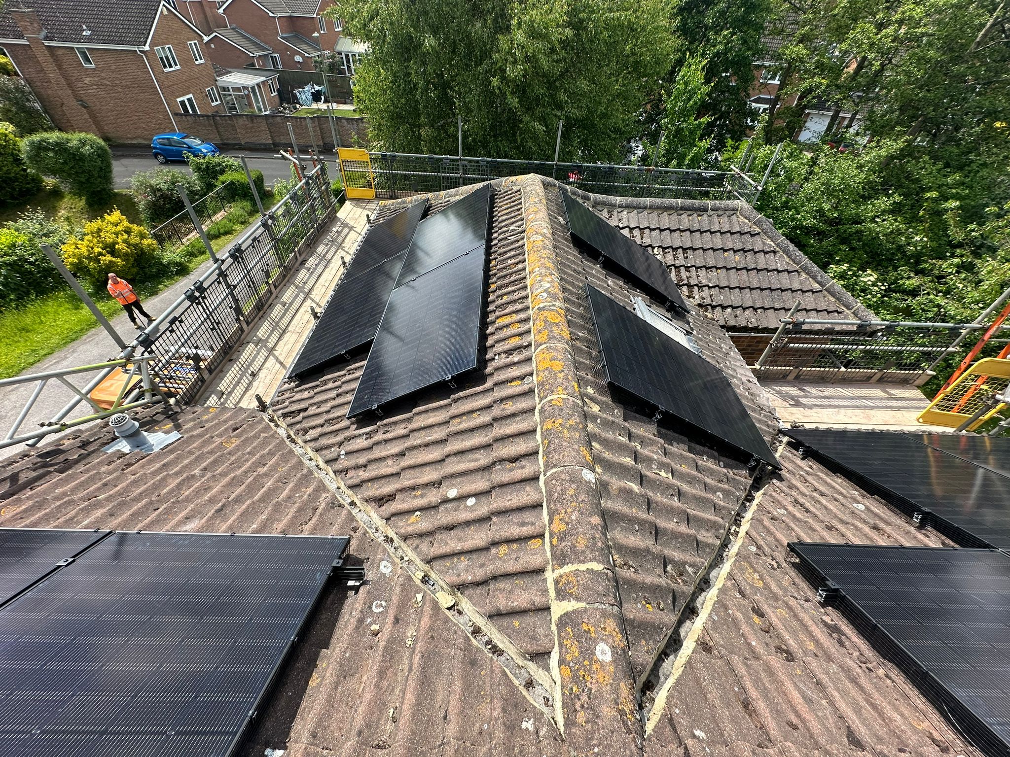 All black Jinko 435w solar panels installed on a concrete tile roof. 